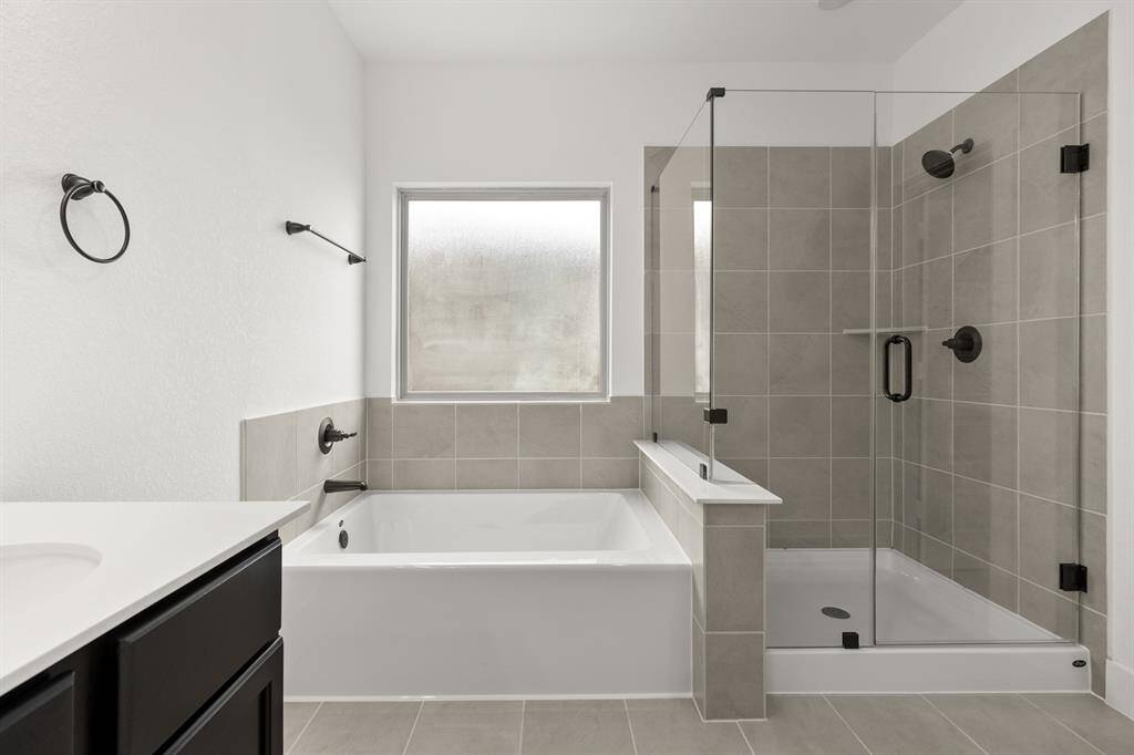 Picture yourself soaking in a deep, freestanding tub, surrounded by calming hues and the g