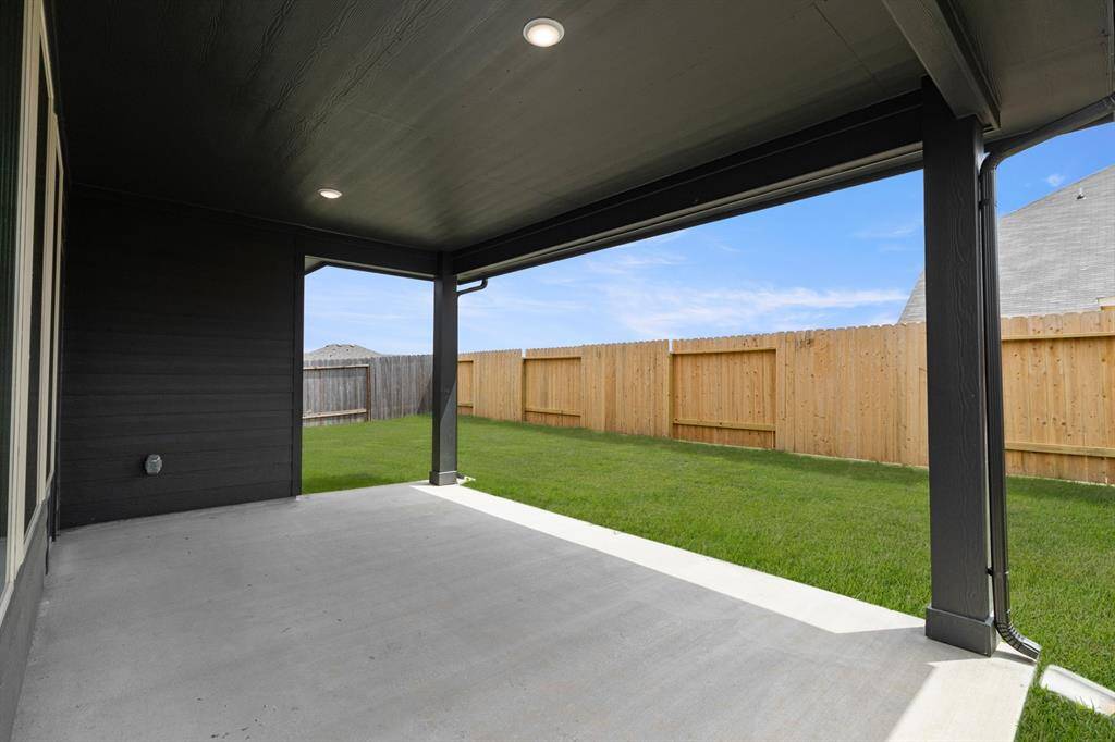 Imagine stepping into your own personal oasis—a spacious covered back patio that invites y