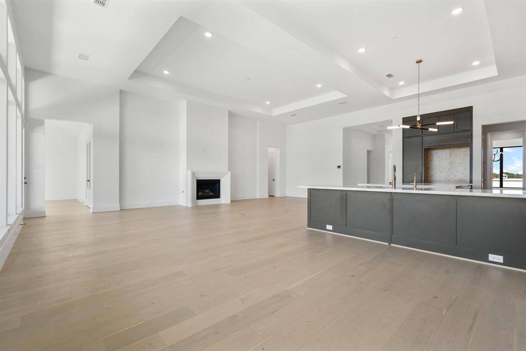 An open-concept kitchen, dining, and family room area that seamlessly blends functionality and comfort, perfect for everyday living and entertaining.