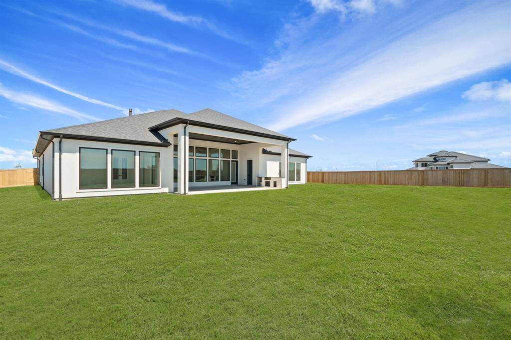 A spacious backyard offering plenty of room for outdoor activities, gardening, and relaxation.