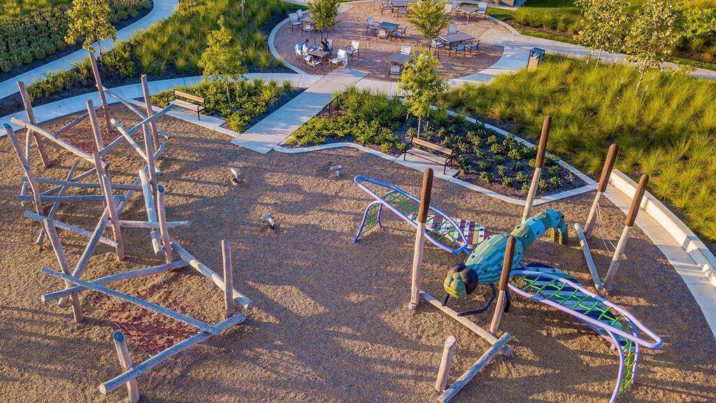 Dragonfly Park in Bridgeland is a charming urban oasis featuring lush green spaces, a tranquil pond, and a variety of recreational amenities for visitors to enjoy.