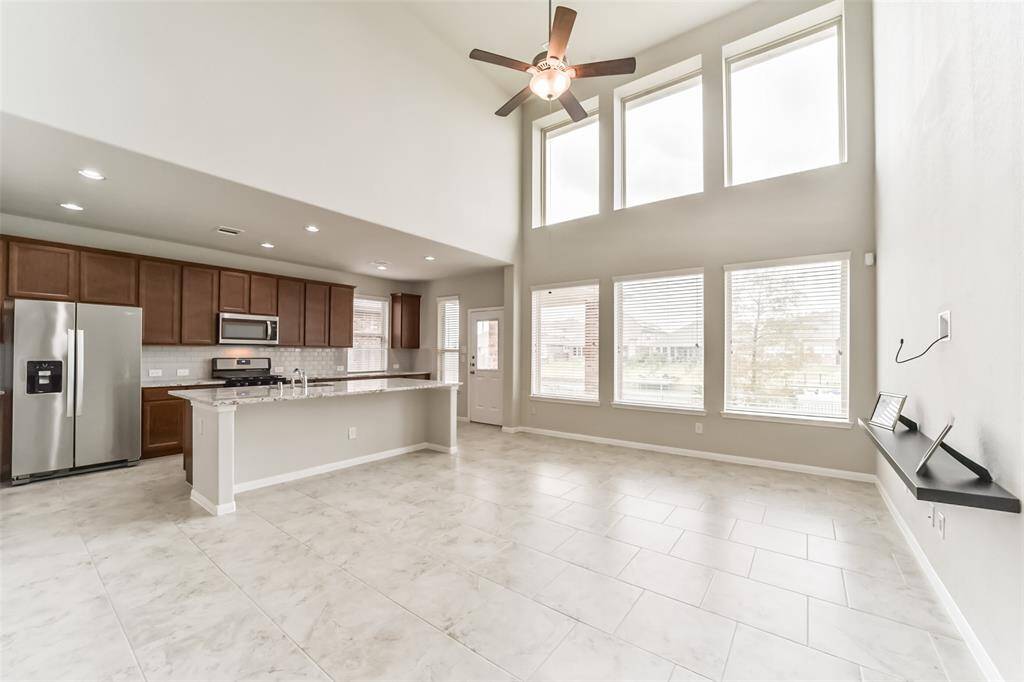 From this view, you can see the roomy living space downstairs that is light and bright from natural sunlight which pours in from the large, energy efficient, double pane windows.
