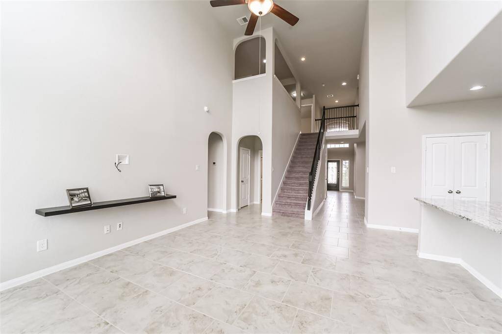 As you make your way upstairs, the upstairs flex room is a fantastic layout for entertaining.