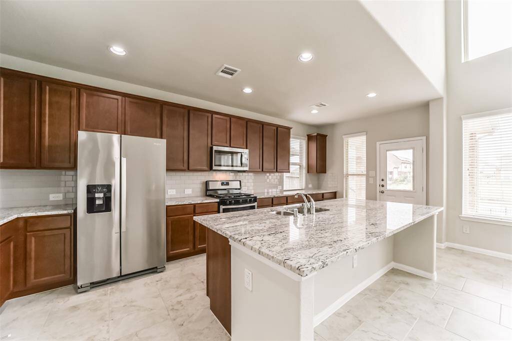 Top of the line kitchen with appliances included, beautiful countertop, one piece, with just a little sparkle