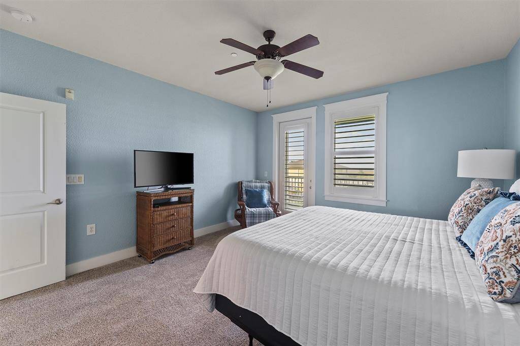 Thoughtfully designed with comfort in mind, the primary bedroom includes a cozy seating area near the window—ideal for enjoying quiet moments with a view.