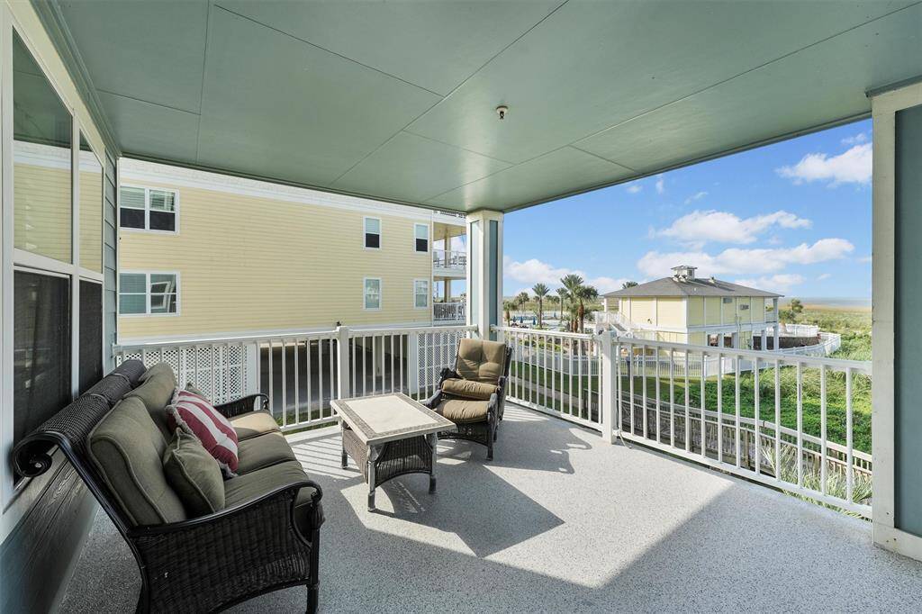 This inviting balcony brings nature right to your doorstep, with easy access to the pool area and scenic paths.