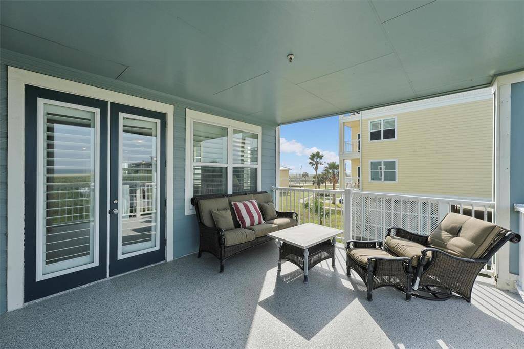 The large balcony features ample space for outdoor seating, perfect for soaking up the sun or enjoying quiet moments by the bay.