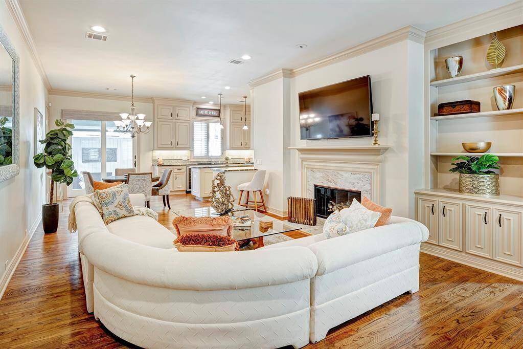 Den is open to the breakfast room and kitchen. Built ins. 2nd fireplace with gas starter. No carpet is downstairs/