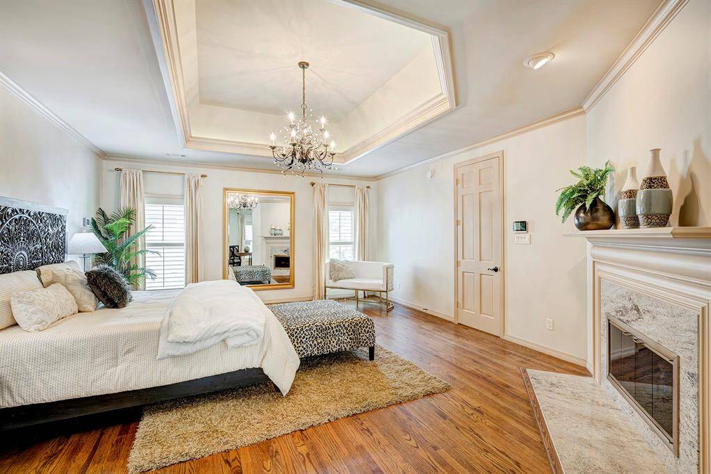 Stunning primary room with recessed ceiling. Doors goes to hall. 3rd gas fireplace.