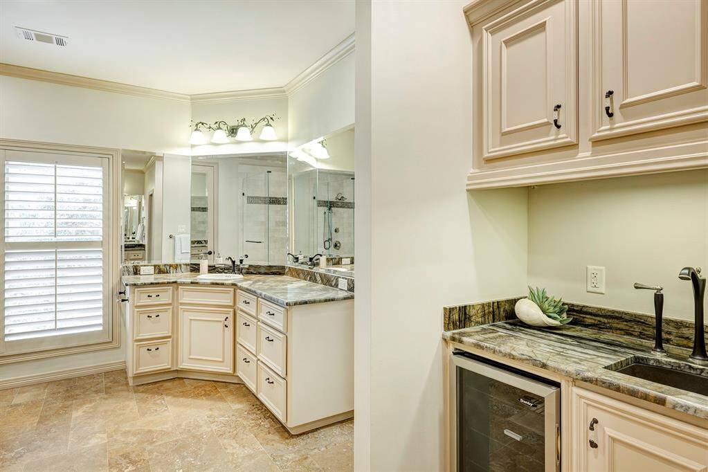 View of the bar area in the primary bathroom. Plug for coffee machine.