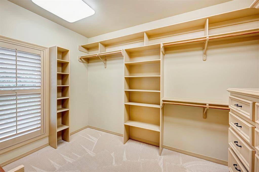 Closet 2 with large window and built ins.