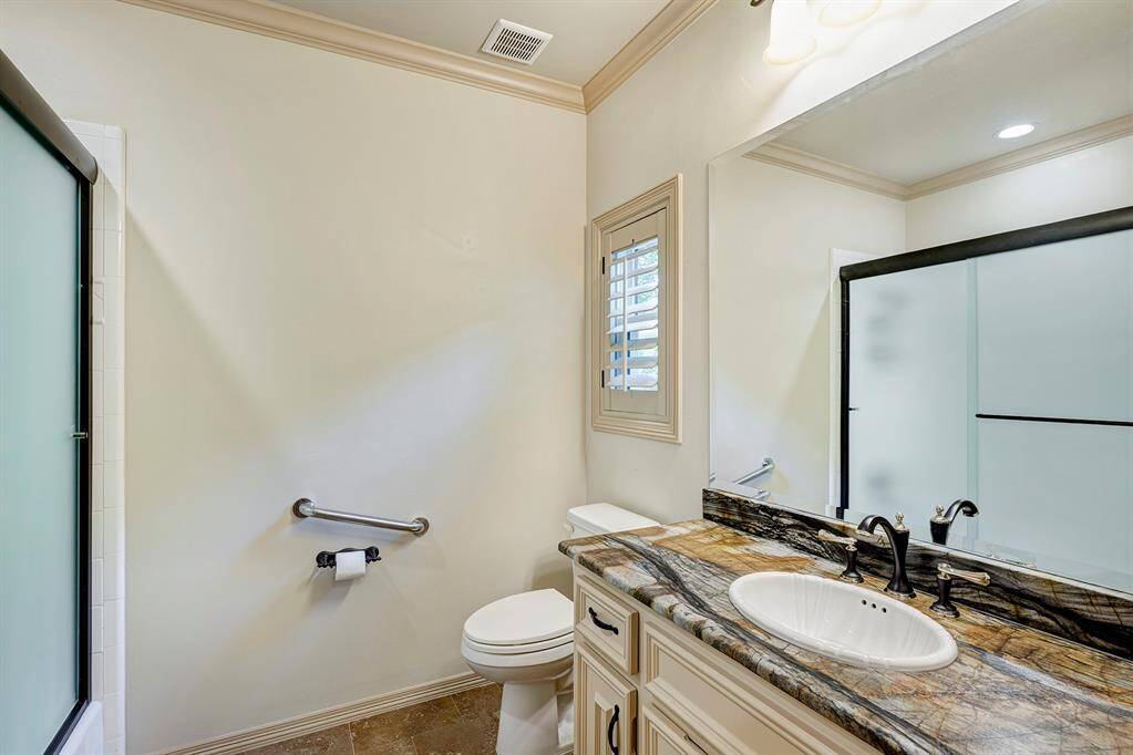 Private Bathroom for bedroom with cabintry.