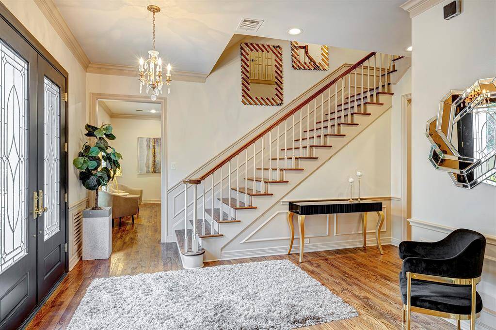 Generous entry. Wood stairs. ACs have been replaced in recent years.