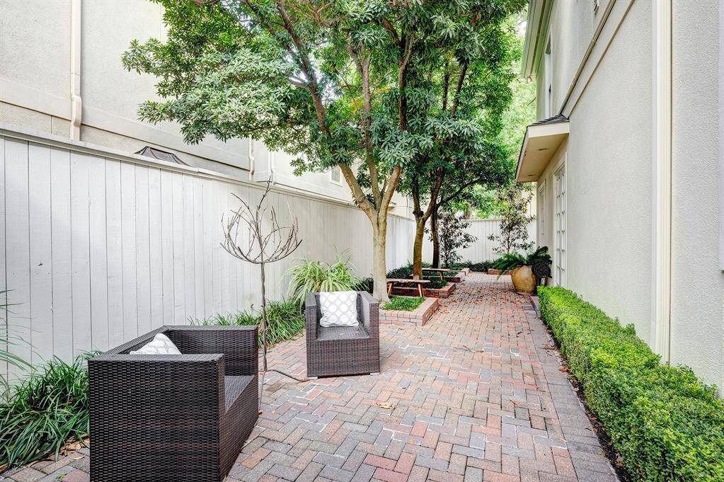 Charming and low maintenance landscaping  with brick pavers