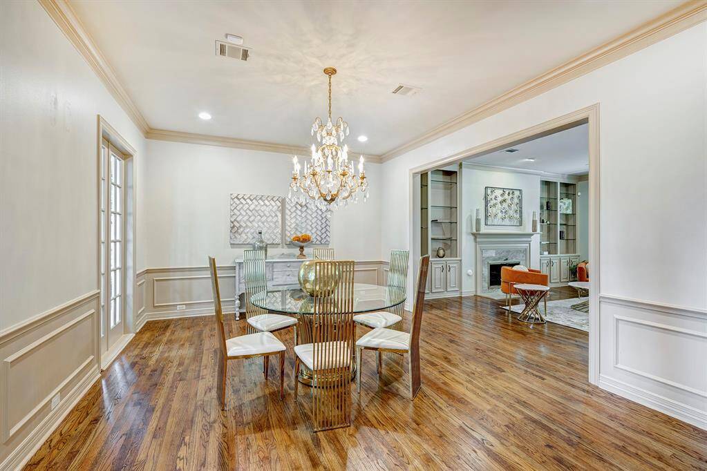 Dining room opens to the living room. Chair rail molding.