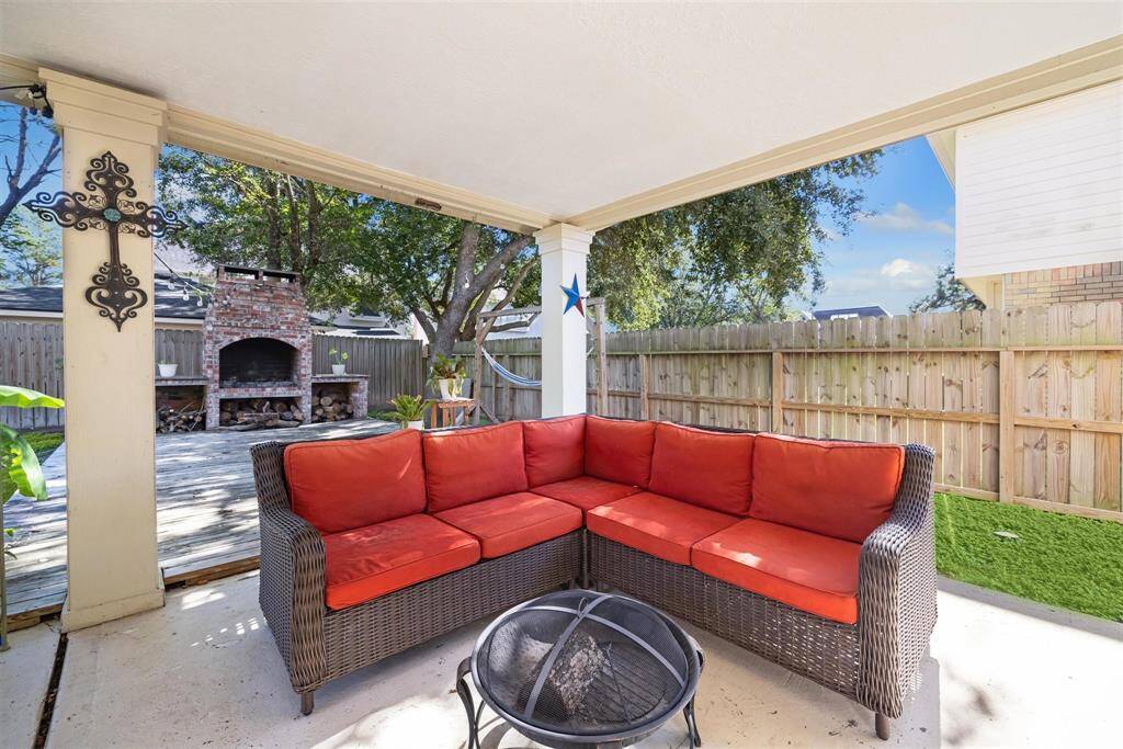 Large covered patio is ready for a morning cup of coffee or an evening relaxation.