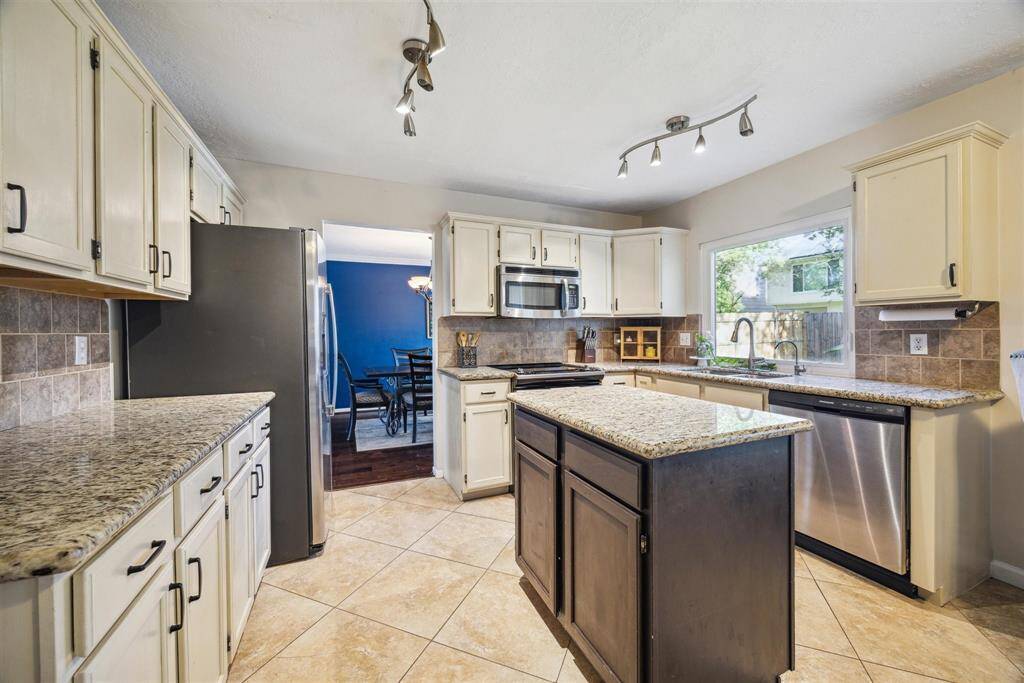 Kitchen offers stainless steel appliances and granite countertops!