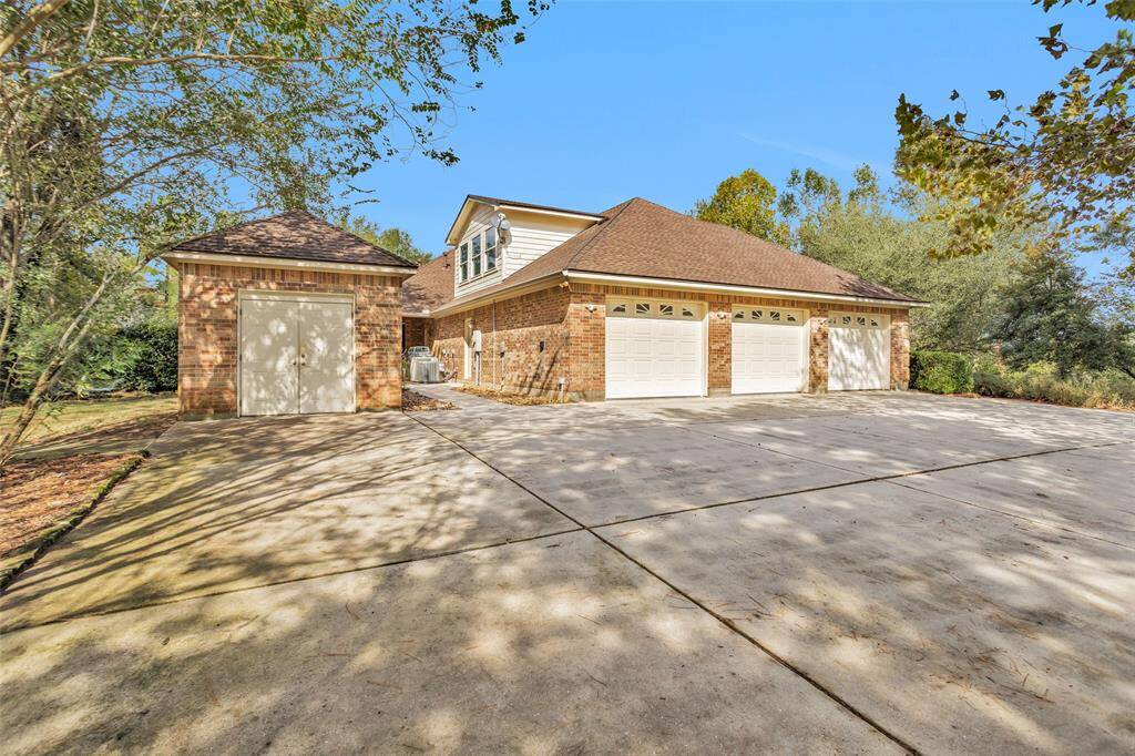 3 car garage and storage shed with plenty of additional parking.