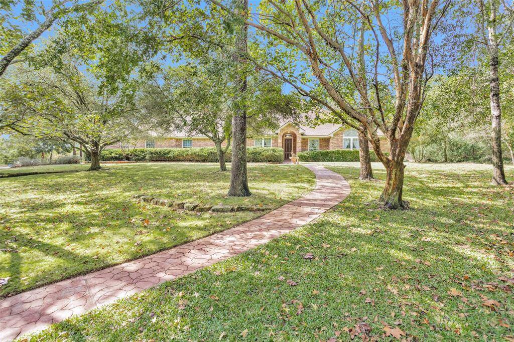 This property includes its own water well, providing efficient irrigation to keep the landscaped areas lush and vibrant year-round, perfect for Texas weather.