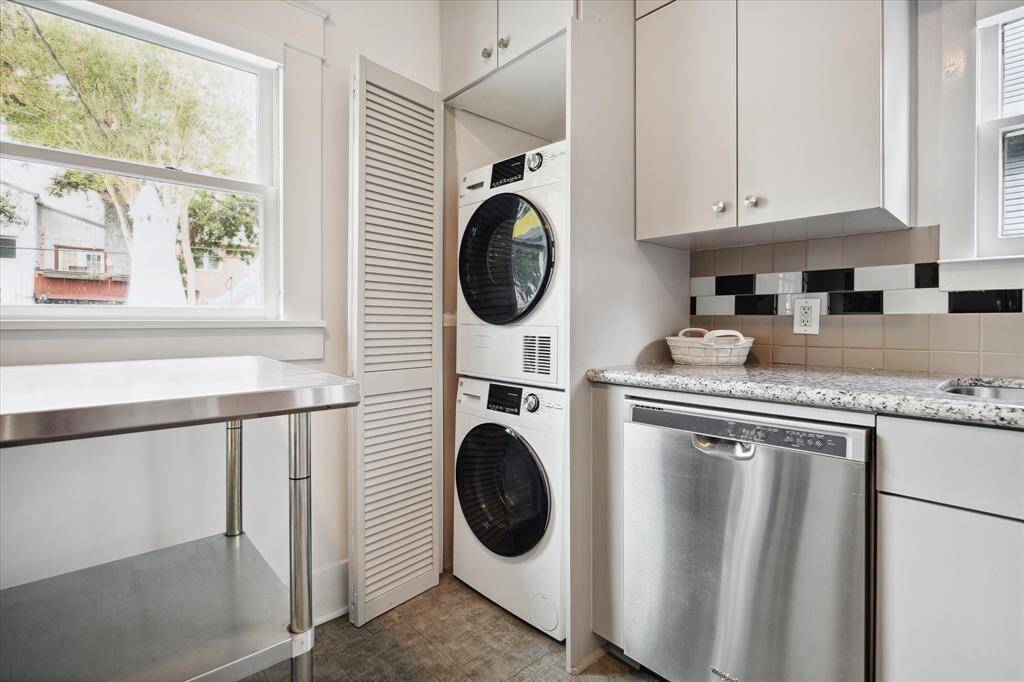 The washer and dryer are conveniently tucked away in the corner of the kitchen.