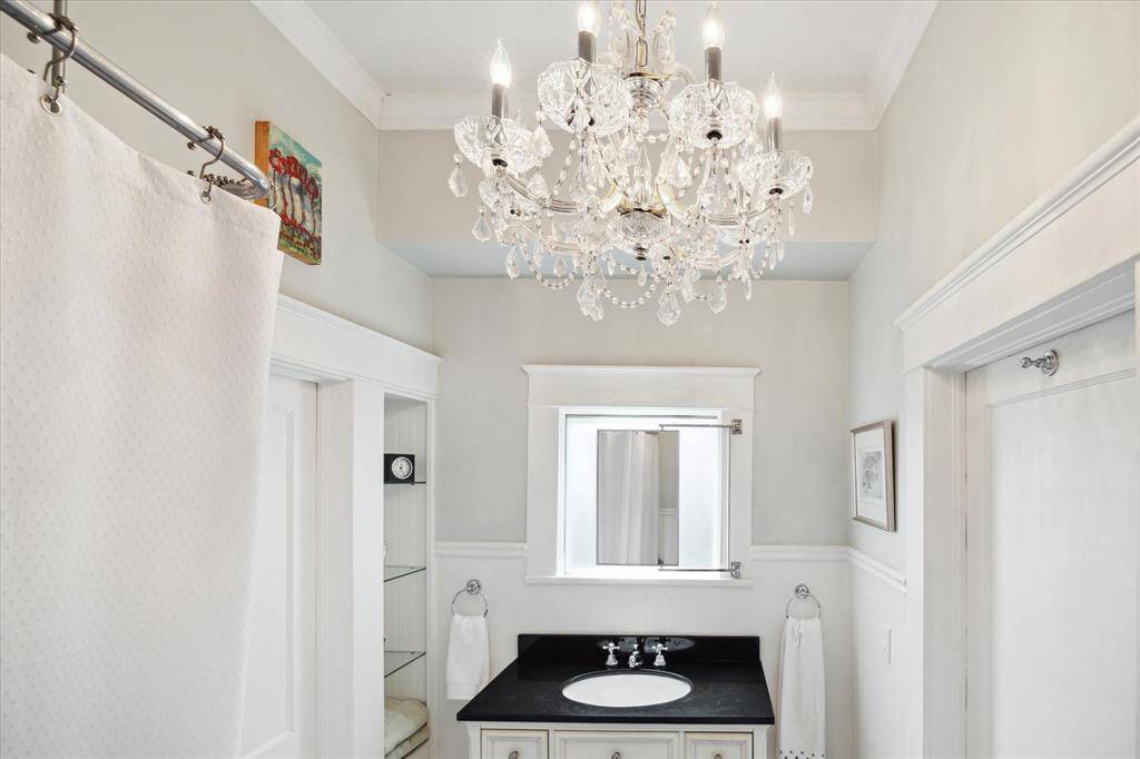 We love this gorgeous chandelier in the bathroom!
