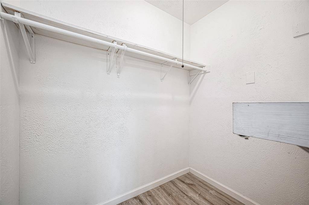 Walk-in primary bedroom closet