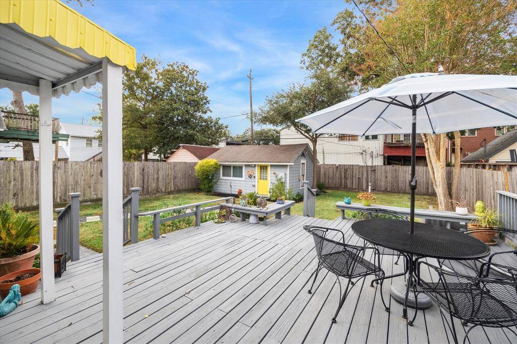 The raised wooden back patio is expansive and provides an ideal setting for dining, relaxing or entertaining, with fantastic space to enjoy the outdoors and large backyard.