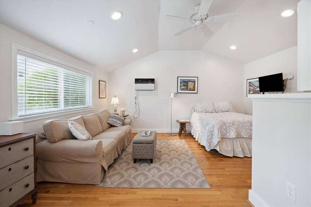 The raised ceiling, large windows, and recessed lighting create an open, airy atmosphere, giving a bright and welcoming feel!