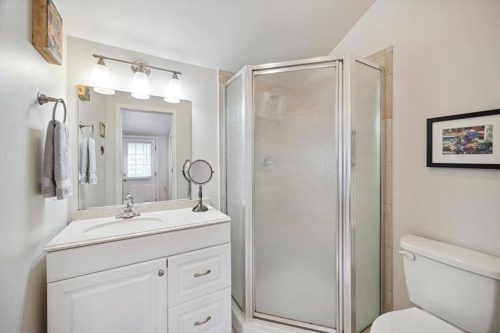 The guest house bath features a shower, offering all the essentials for comfort and convenience.