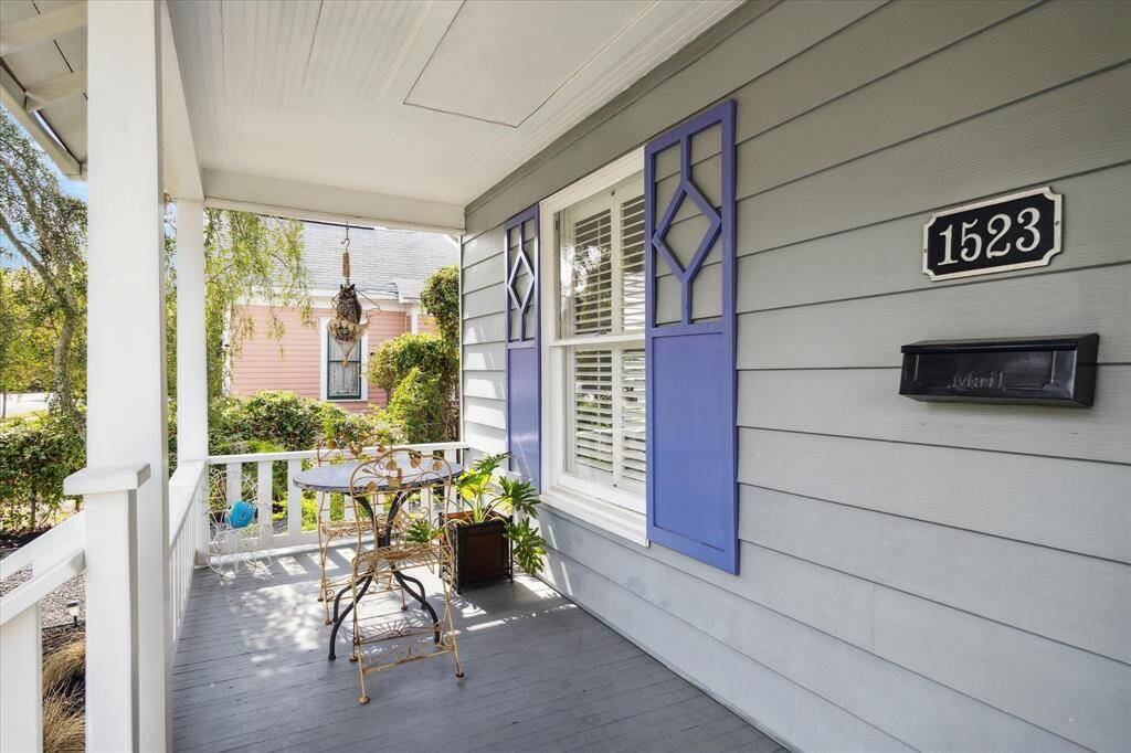 The inviting front porch is the great spot to enjoy your morning coffee while taking in the views of the lovely neighborhood and sought after street!
