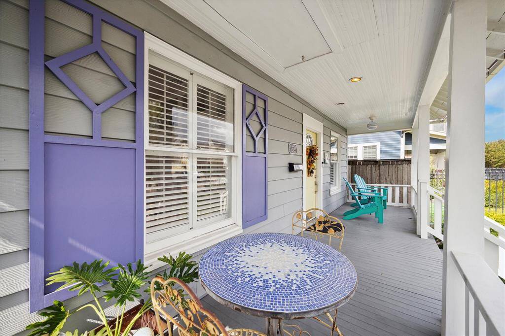 Another view of the fantastic front porch. You’ll notice the door on the ceiling—this leads to a spacious attic, offering room for storage.
