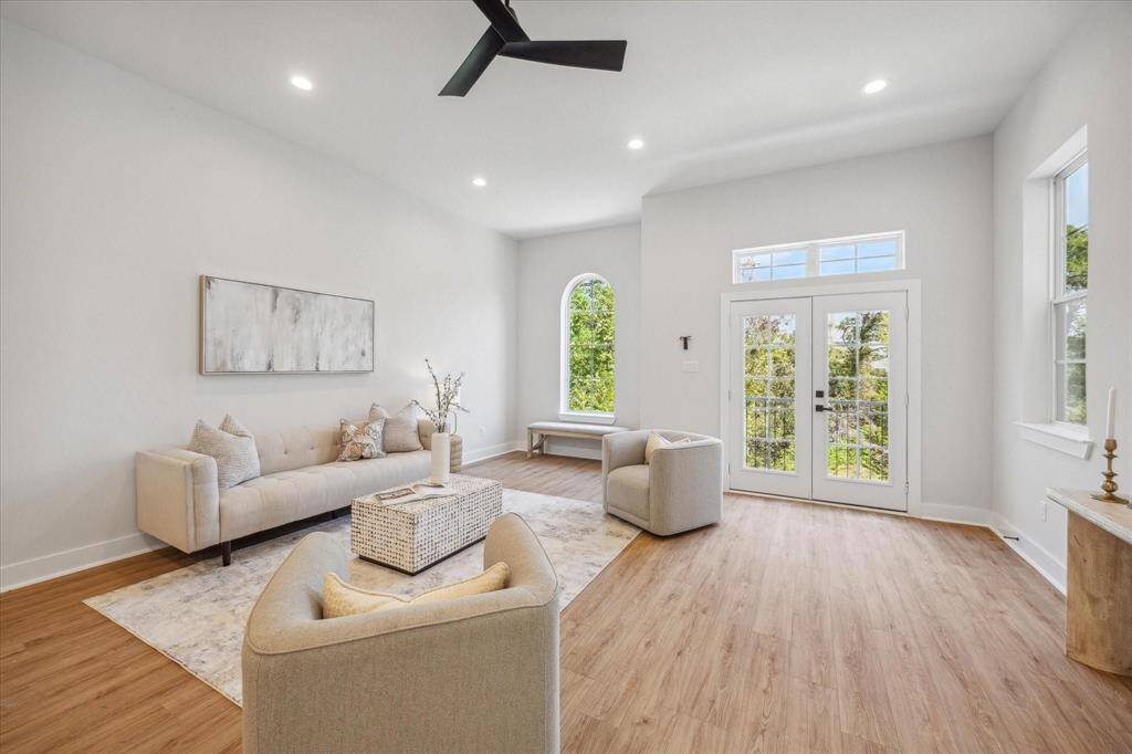 This living room is large enough to fit a sectional! Notice the double doors leading to the balcony.