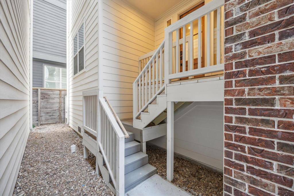 View of the entrance to your new home and graveled side-yard