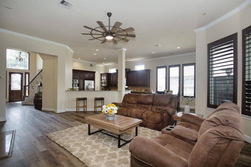 The family room, open to the kitchen and breakfast room, features a convenient breakfast bar opposite the kitchen sink.