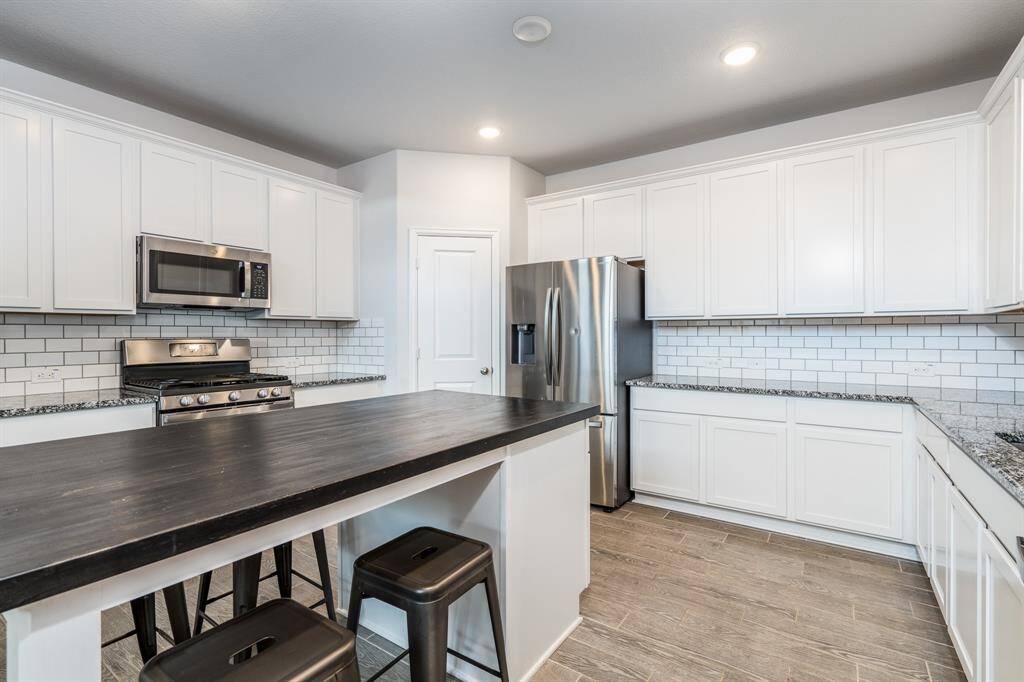 Wow! This truly is an entertainer's kitchen! Imagine friends and family surrounding this island enjoying a glass of wine while a meal is being prepared!