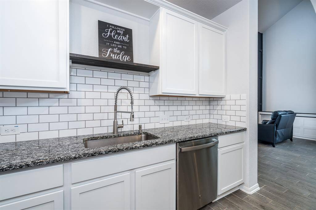 Another view of this modern yet functional kitchen. Plenty of prep and storage space for the resident chef!