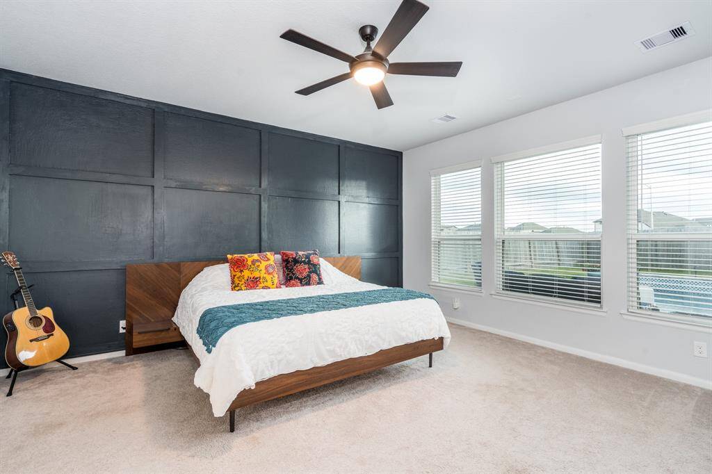 Welcome to your serene owner's retreat! A wall of windows sheds abundant light into this huge space! A gorgeous custom paneled accent wall completes the look!