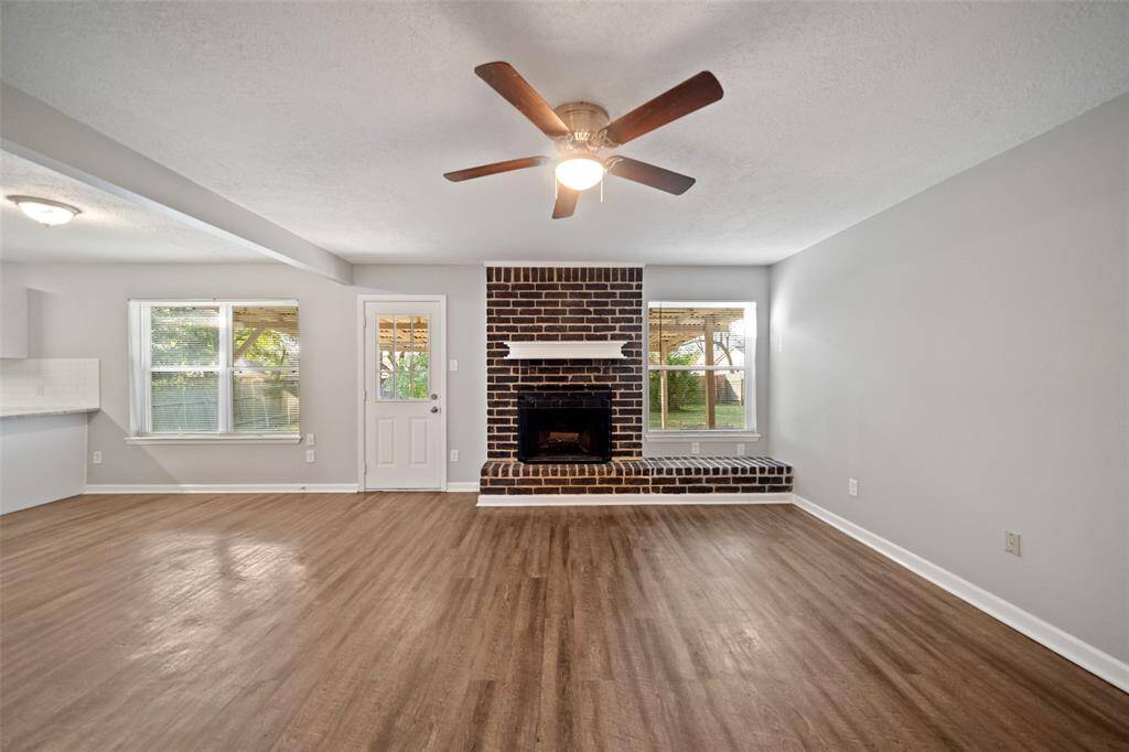 Cozy fireplace and large windows make this space very welcoming.