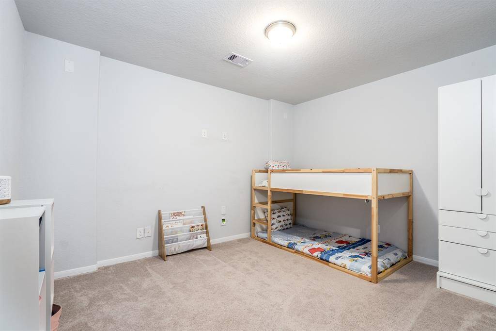 The media room is currently being used as a fifth bedroom. This spacious room is the just the right flex space to suit your needs!