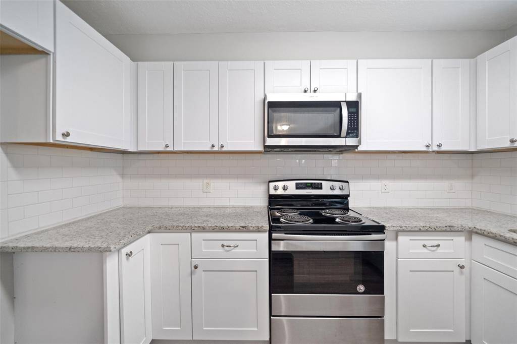 Kitchen with ample cabinet storage.