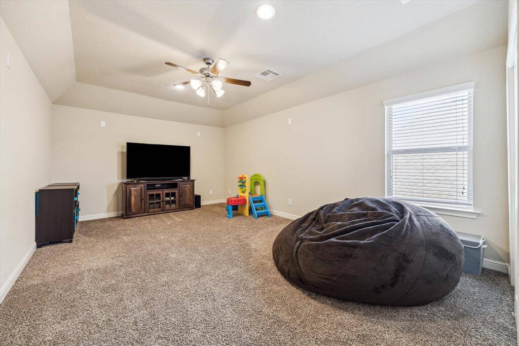 This massive media room could also be the 5th bedroom as it has a huge closet.