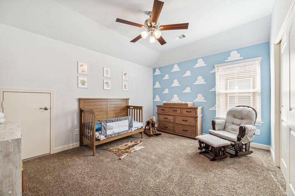 Another one of the secondary bedrooms up with is housing quite a lot of furniture with room to spare.
