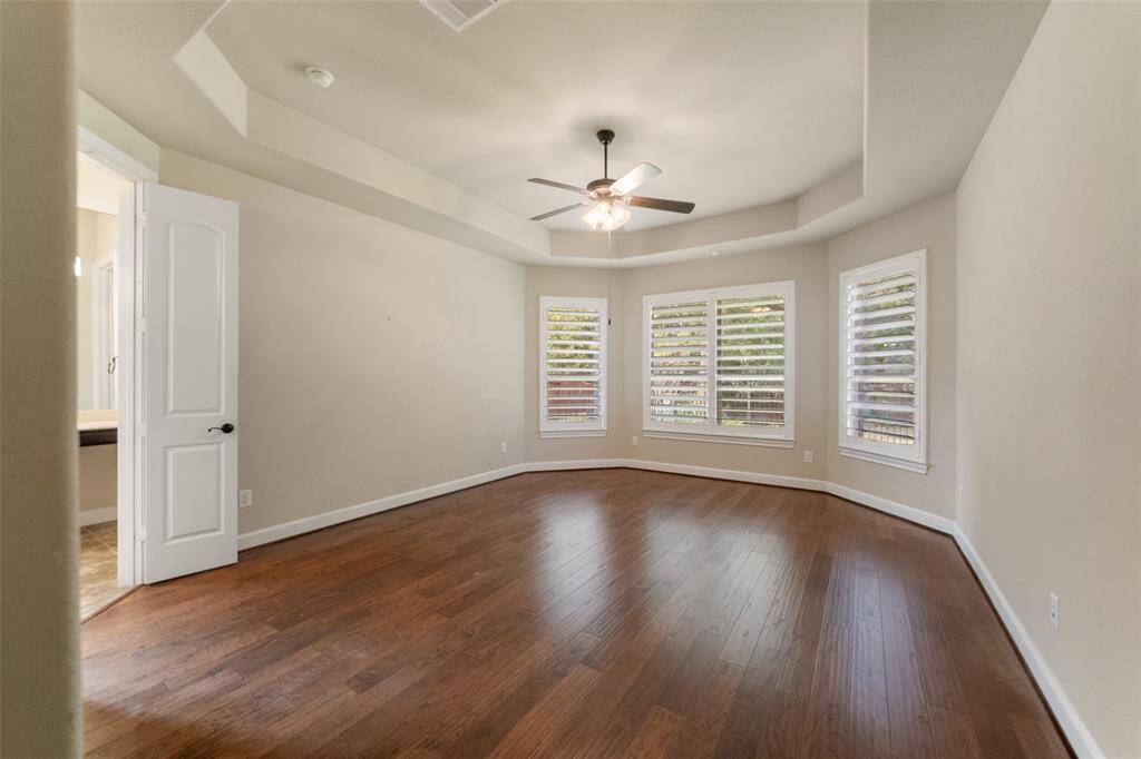 Family Room looking toward back patio and hallway to Primary bedroom