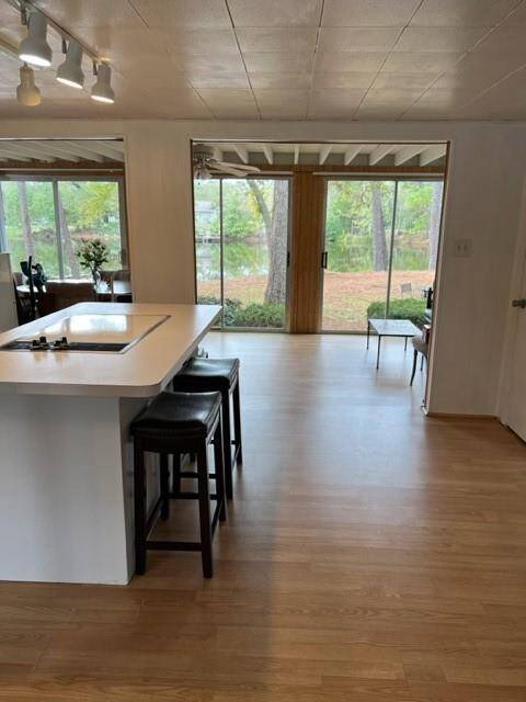 View of island opening into glassed in porch