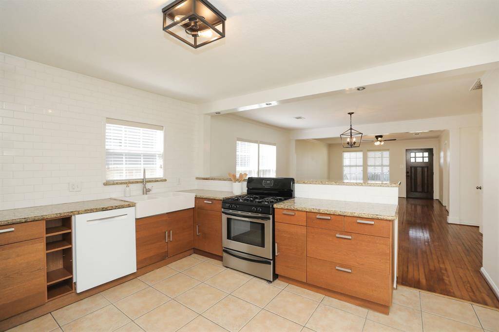 View from kitchen to den and dining area.