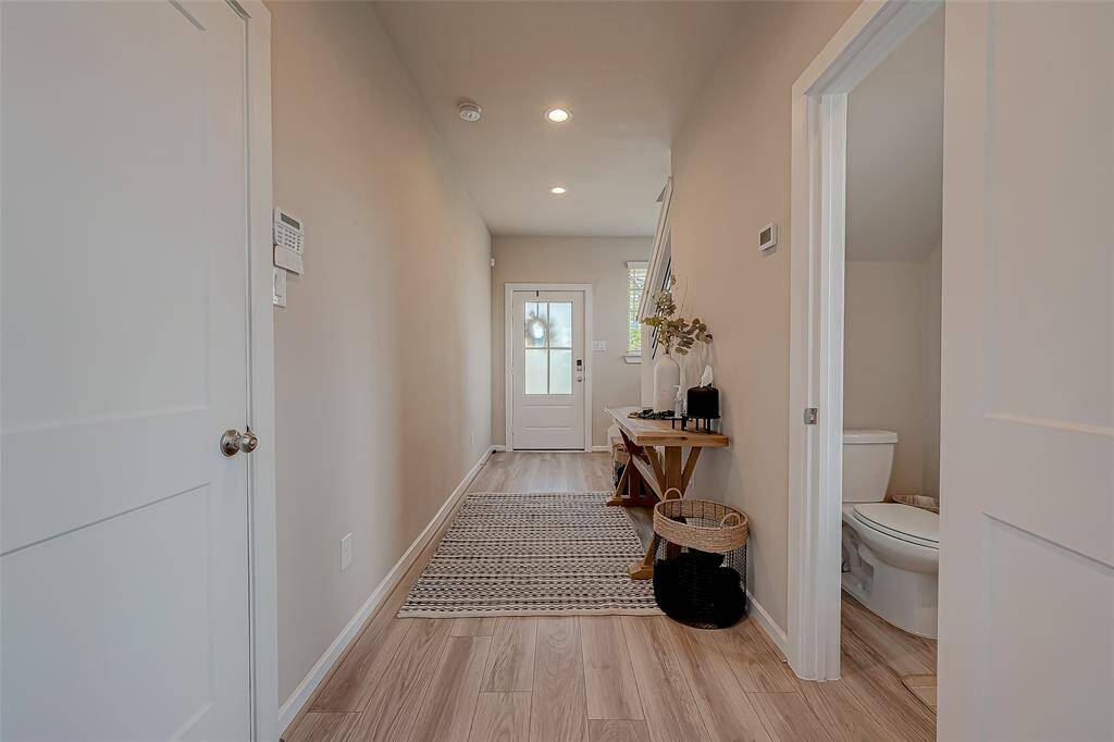 Explore the spacious hallways and stairways connecting all three floors of this home, featuring 2.5 bathrooms. The wide, well-lit corridors provide easy access and a sense of openness, enhancing the home's flow and accessibility.