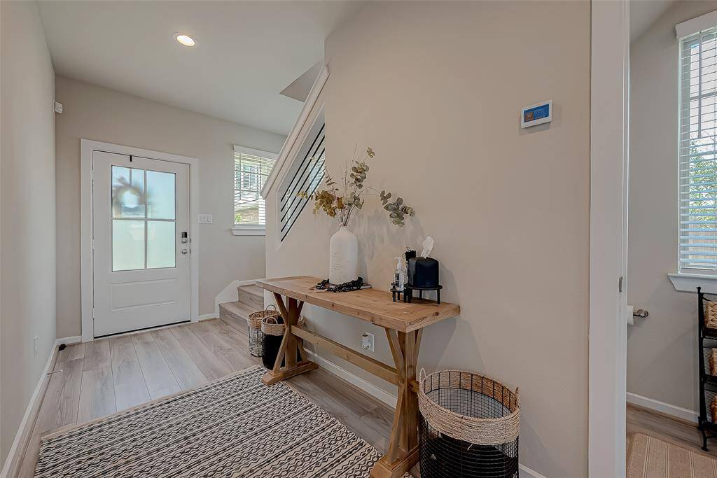 Explore the spacious hallways and stairways connecting all three floors of this home, featuring 2.5 bathrooms. The wide, well-lit corridors provide easy access and a sense of openness, enhancing the home's flow and accessibility.