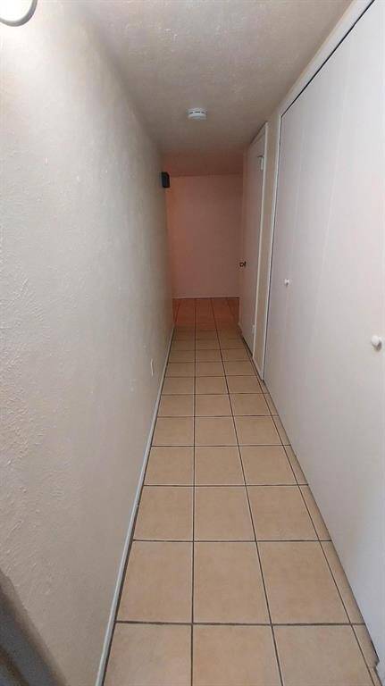 The Hallway with End-to-End Coat Closet and Storage Closet