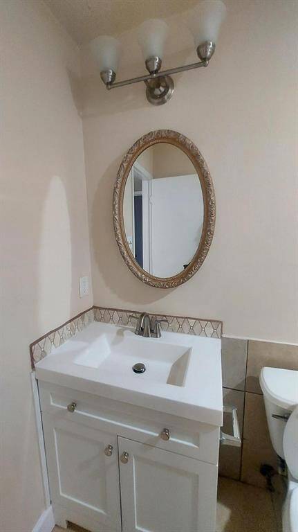 The Hall Bath With New Vanity and Lighting