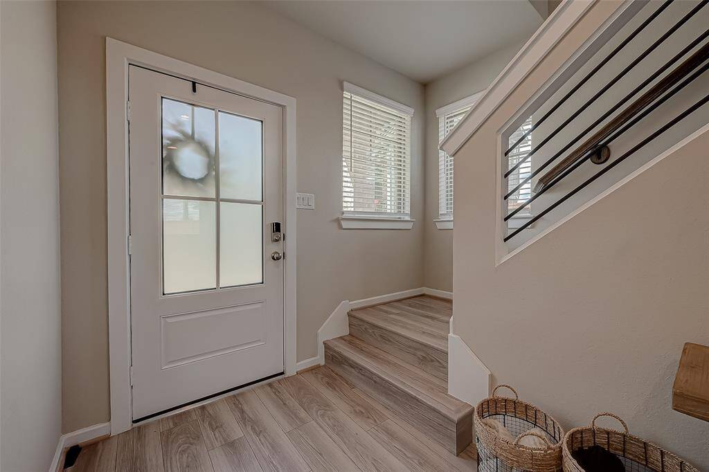 Explore the spacious hallways and stairways connecting all three floors of this home, featuring 2.5 bathrooms. The wide, well-lit corridors provide easy access and a sense of openness, enhancing the home's flow and accessibility.